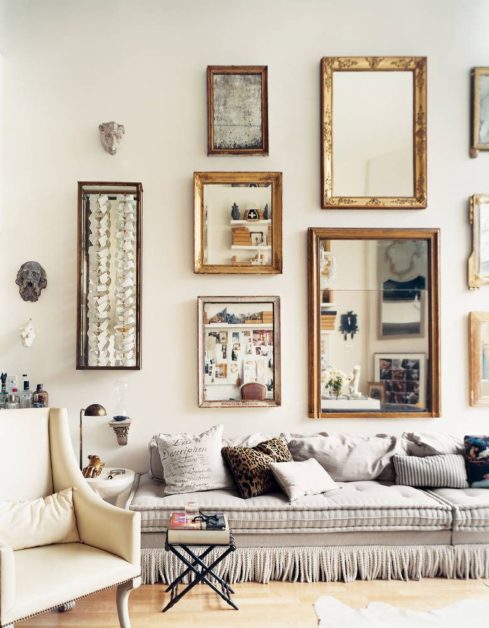 hanging mirrors of different sizes on wall