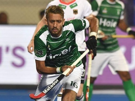 Pakistani Player playing hockey, which is a national sport of Pakistan