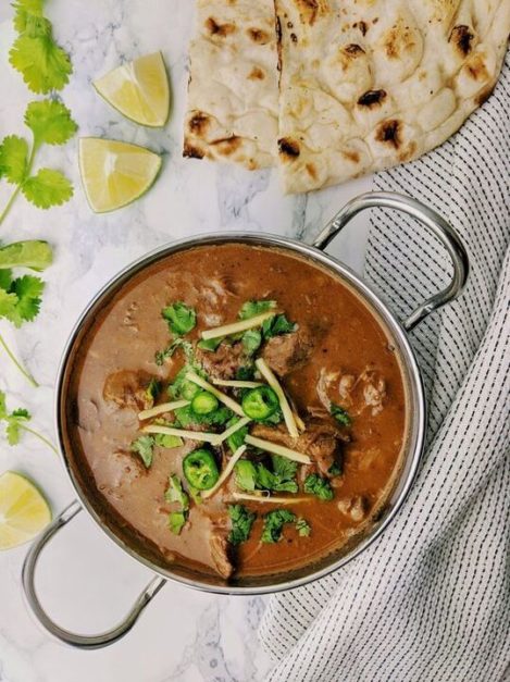 Nihari garnished with coriander, ginger served with naan is a national Food - National Symbols of Pakistan