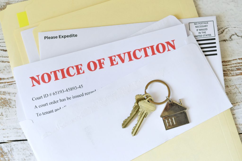 Letter reading Notice of Eviction and keys placed on top