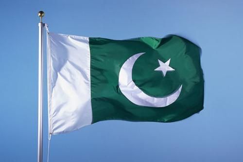 Green and white Pakistan Flag waving in the air - National Symbols of Pakistan