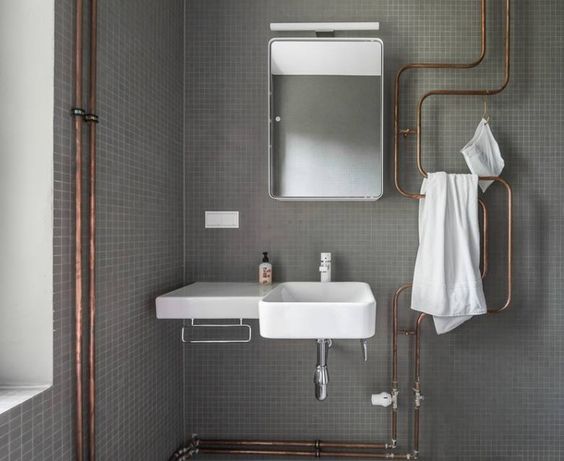 exposed plumbing in bathroom with an aesthetic design