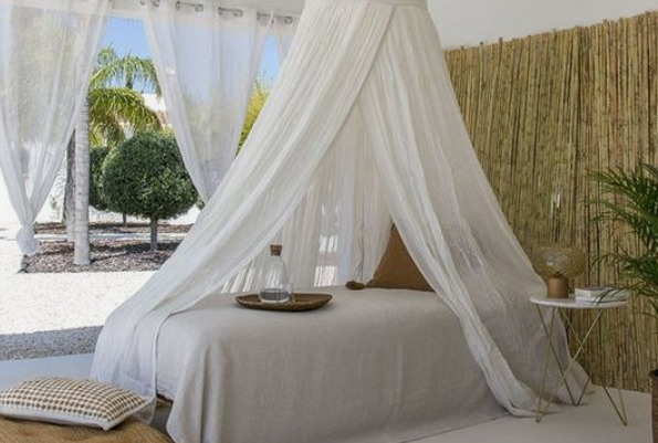 this is an image of a bed canopy which was taken as one of the DIY Ideas on how to make your bedroom more cosyd