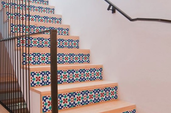 this is ann image of wallpaper pasted on stairs rise which is one of the Staircase Makeover Ideas on a Budget