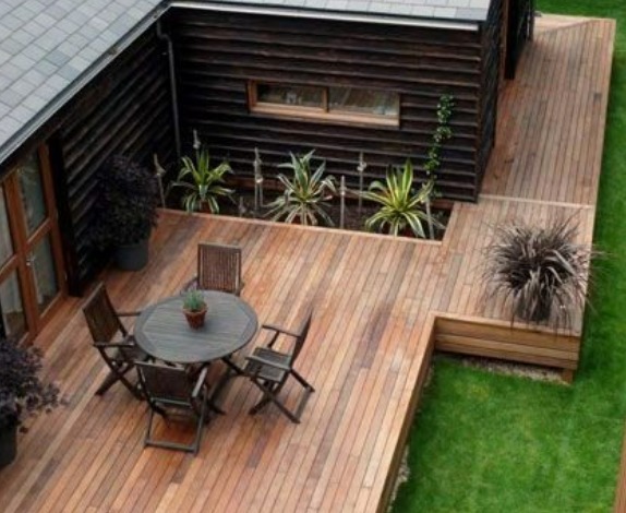 This is an image of a wraparound deck | patio, deck, and porch