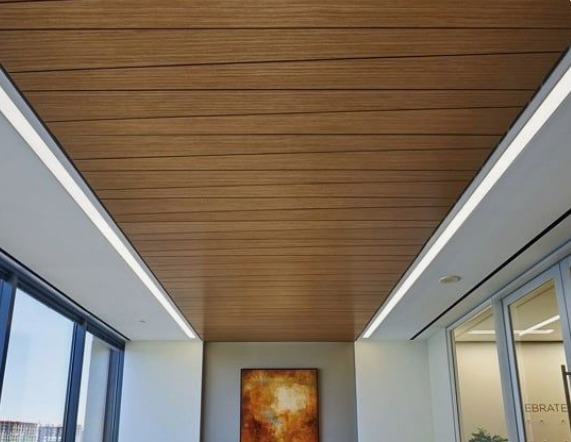 Brownn coloured PVC ceiling oanels on a living room's ceiling