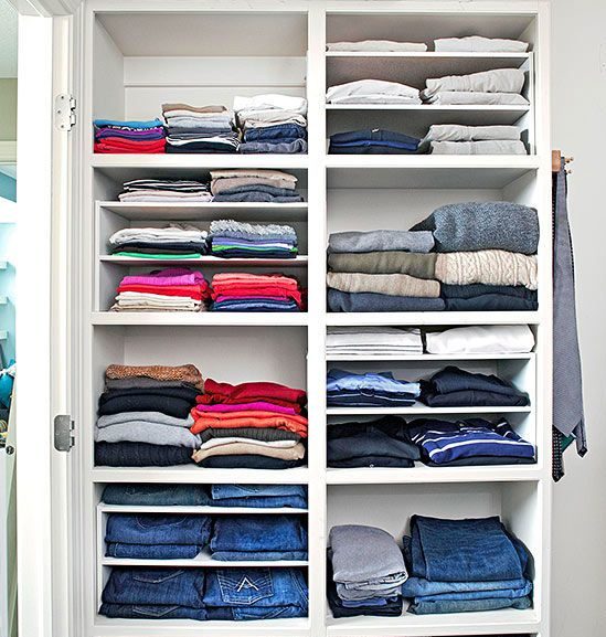 folded clothes organised in closet