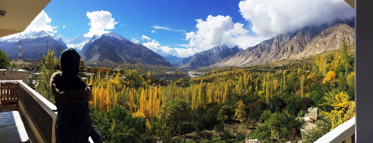 A girl standing at the balcony of hotel in karimabad hunza