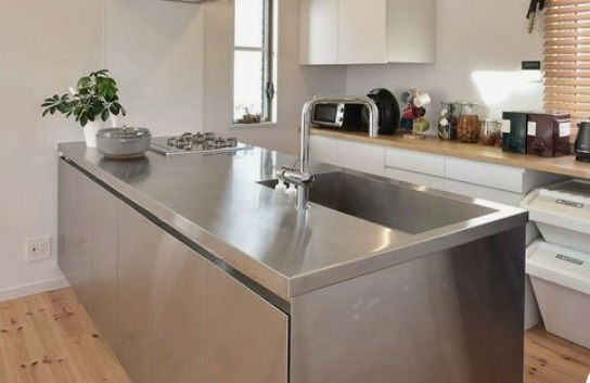 a large stainless steel kitchen countertop