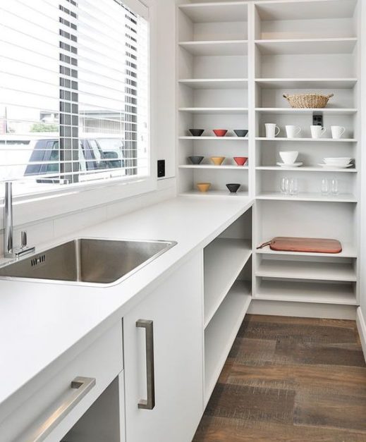White dirty kitchen design with shelves