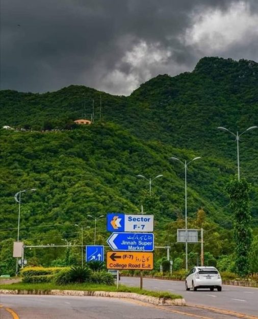 Veiw of margalla hills with a backgrounf of clouds with busy roads