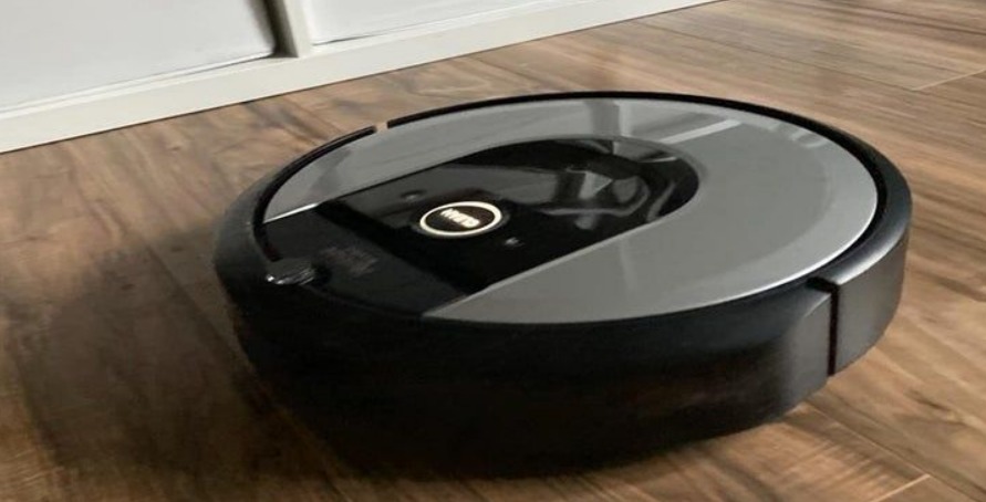 An automated vacuum cleaner cleans the room