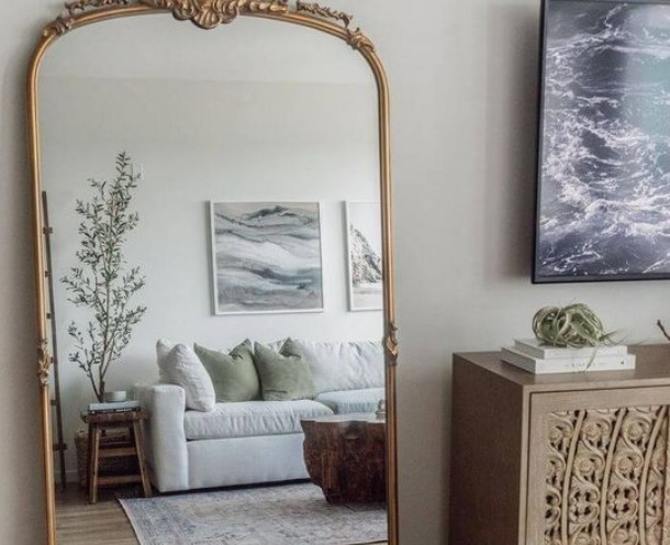 this is an image of mirror in bedroom that is a part of minimalist decor