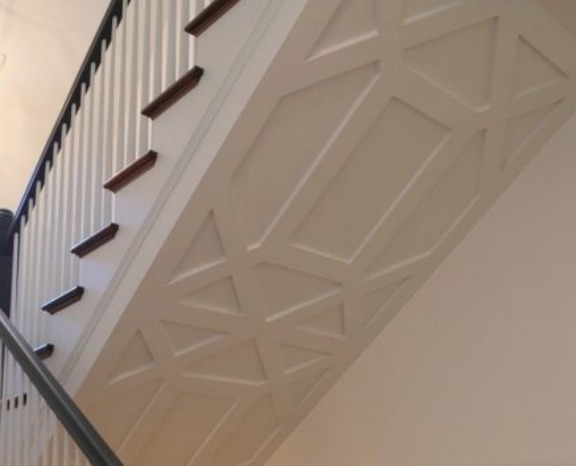 pvc composite wall panels pasted underneath the staircase of a house