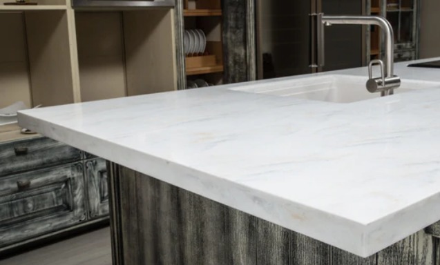 a white coloured solid surface kitchen counter