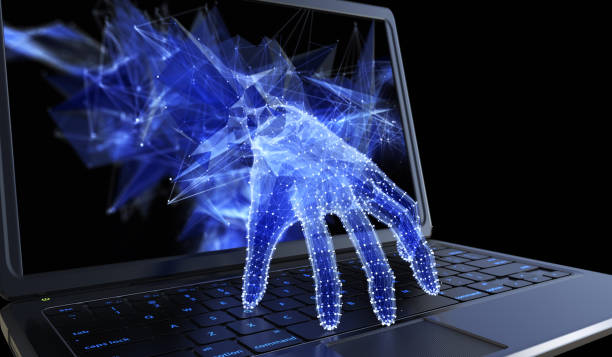 کمپیوٹر ہیک کرنے کے لیے ایک ڈیجیٹل ہاتھ اور لیپ ٹاپ