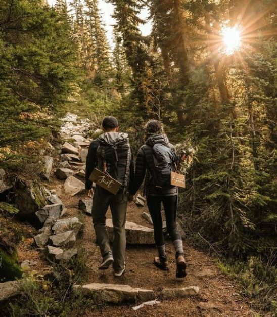 Couple hiking in the mountains through a hiking trail