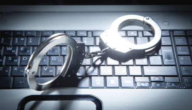 Handcuffs on the computer keyboard.