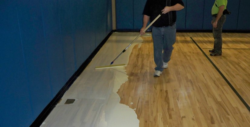 a person applying Polyurethane Liquid Membrane Waterproofing in pakistan