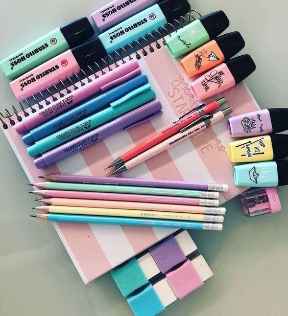 Coloured Pens, Highlighters, and Notebooks in Stationary Store