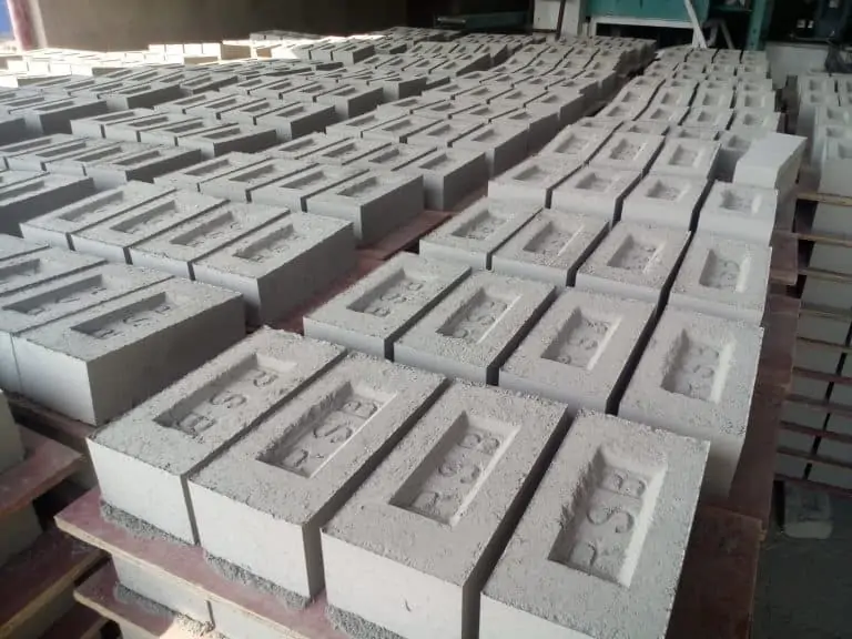 numerous fly ash clay bricks laid on the ground
