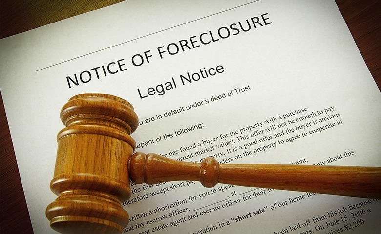 Plaque placed over a document reading "Notice for Foreclosure""