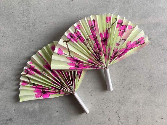 a pair of japanese fan used as alternative ways to survive load shedding