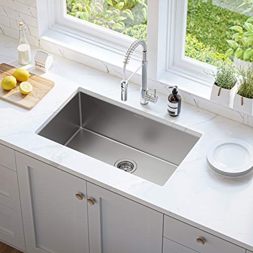 a stainless steel single bowl kitchen sink