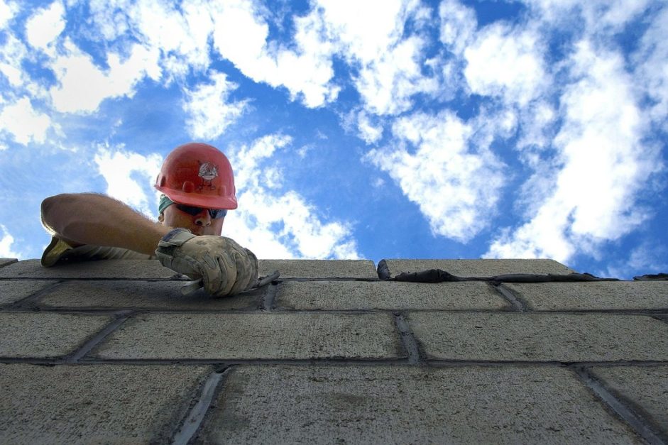 construction labour working with cement and bricks