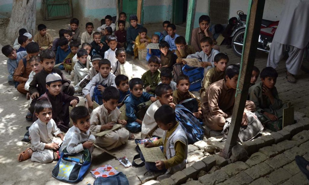 Children sitting in a congested classroom