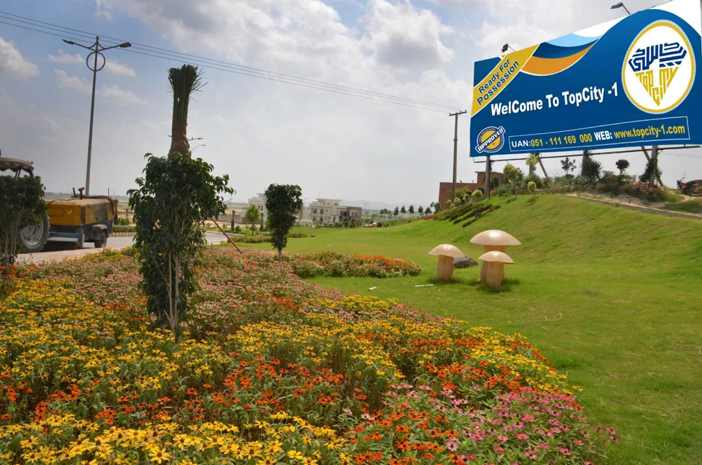 Top City 1 is a meticulously planned housing project with a picturesque view of rolling green hills|Top city Islamabad
