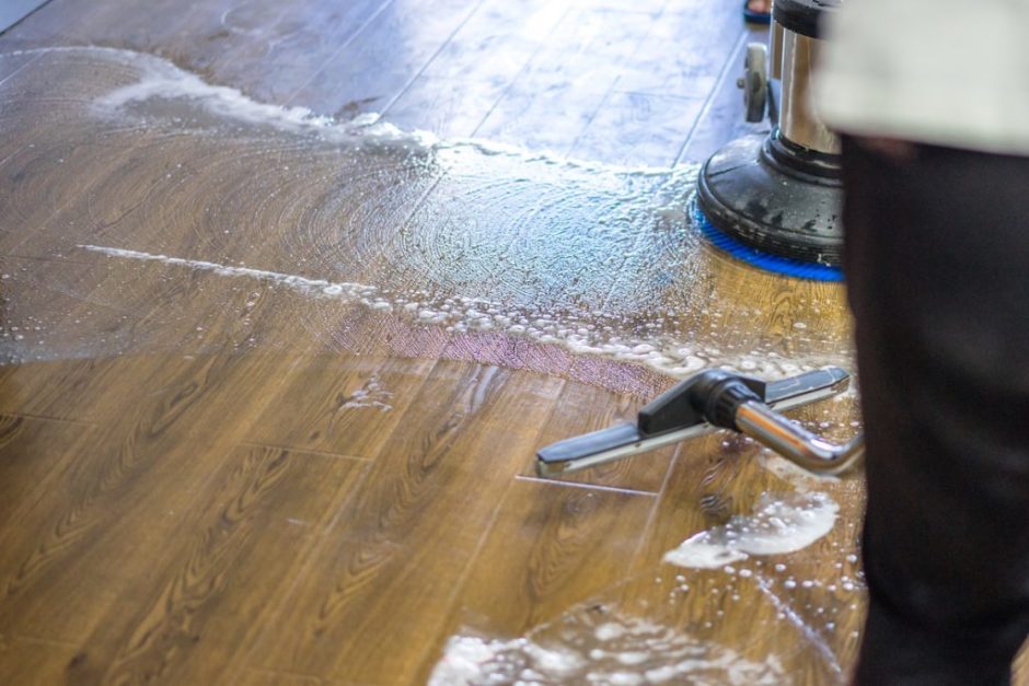 Man removing flooded water from basement