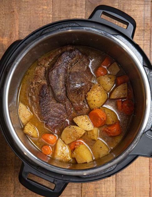 Beef roast cooking in a slow cooker pot - kitchen hacks