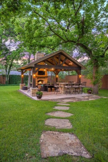 wooden patio with lights and seating in the backyard