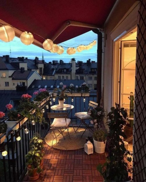 beautiful view from the balcony decorated with flowers and lights