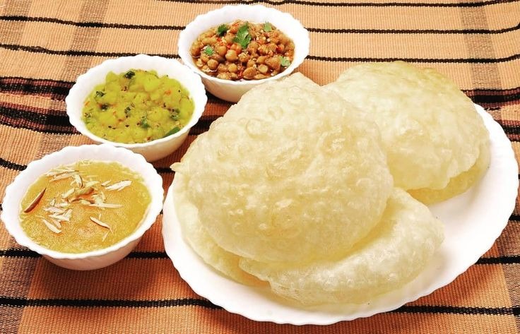 halwa poori with chanay, aloo tarkari and halwa