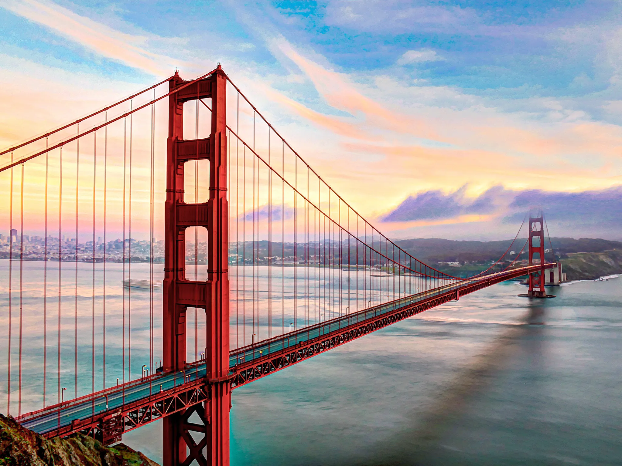 Golden Gate Bridge in California with river and the city in background