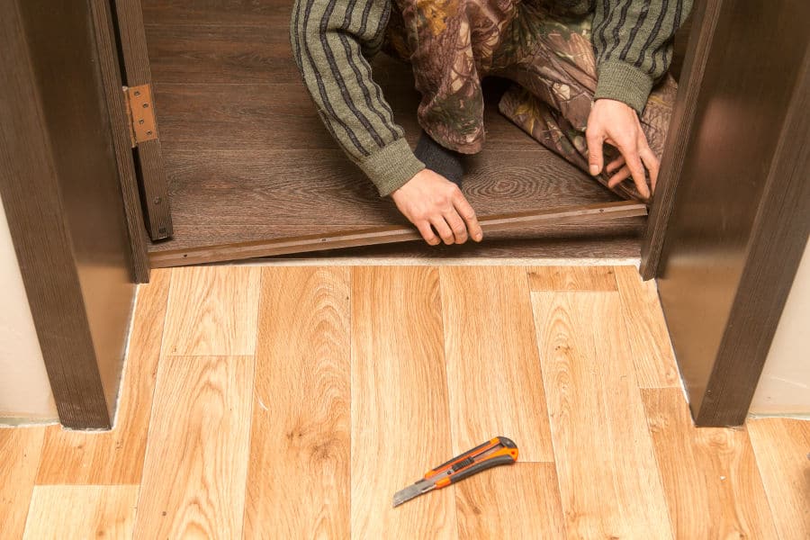 girl installing door sealers