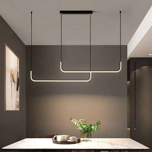 minimal linear pendent lights hanging above shelf