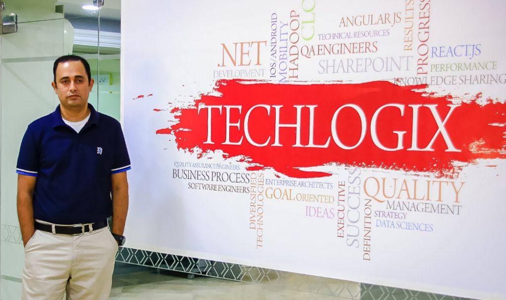 List Of Best Software Houses In Lahore Graana Com   A Man Standing Infront Of Techlogix Board 