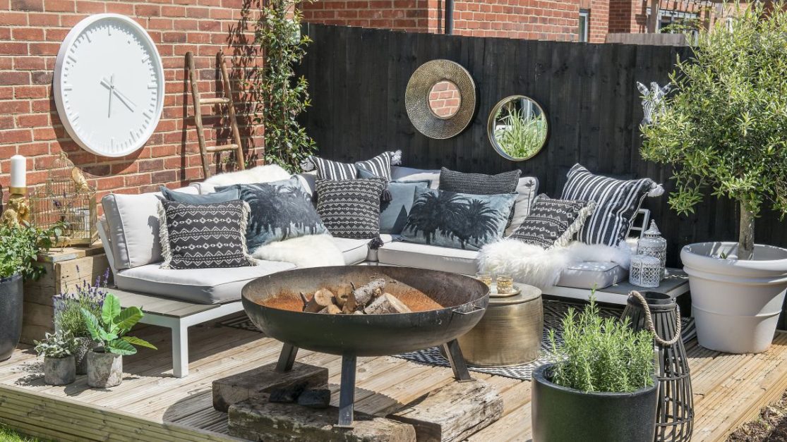 modern furniture and modern fire bowl pit placed in Garden