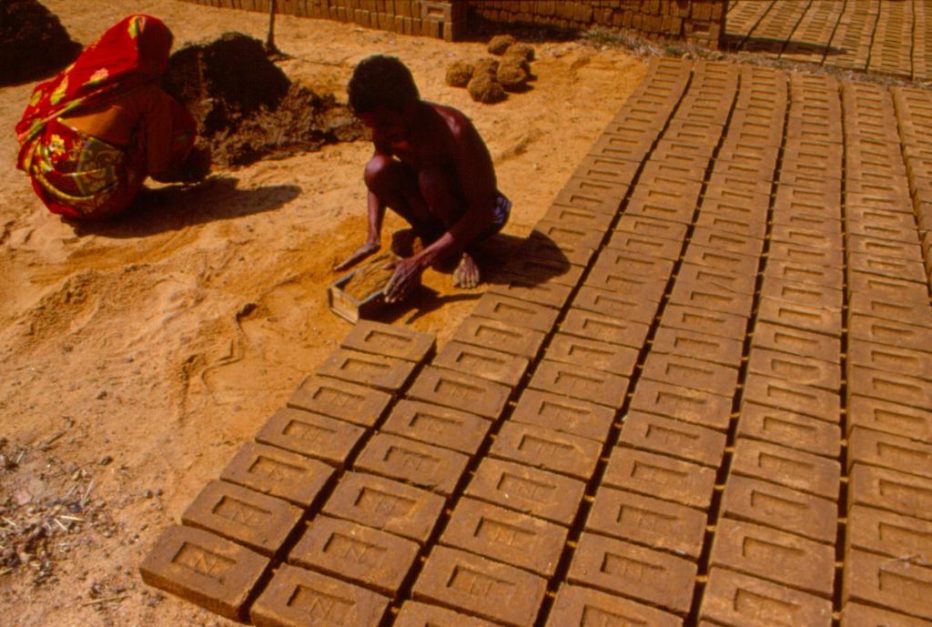 worker arranging brick kilns