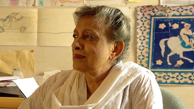 A portrait of Yasmeen Lari sitting in a white dress