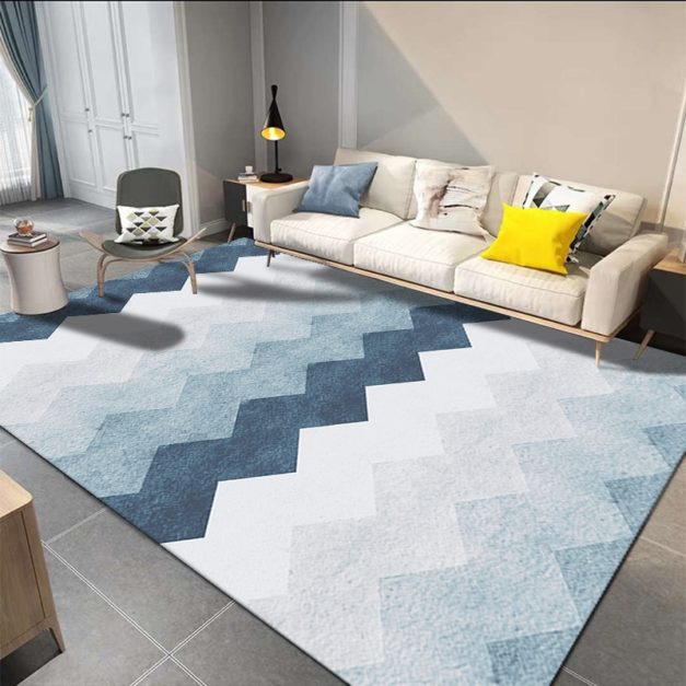 A room filled with Geometric Patterns rug sofa and chair