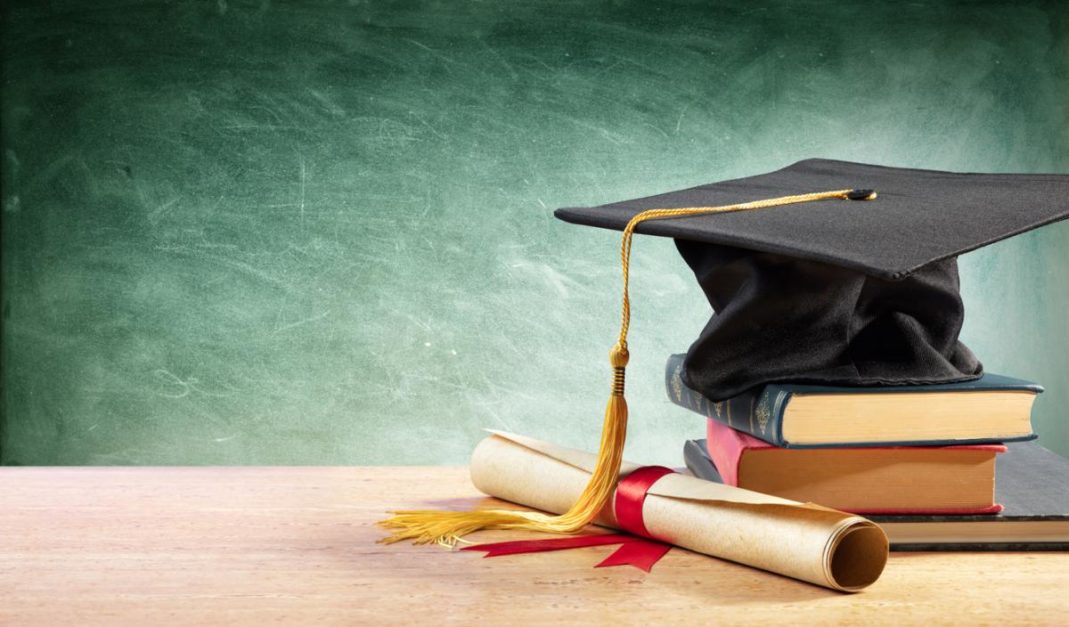 Books degree and a graduation cap