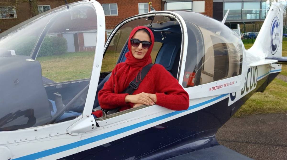 Dr. Sarah Qureshi sitting in a craft
