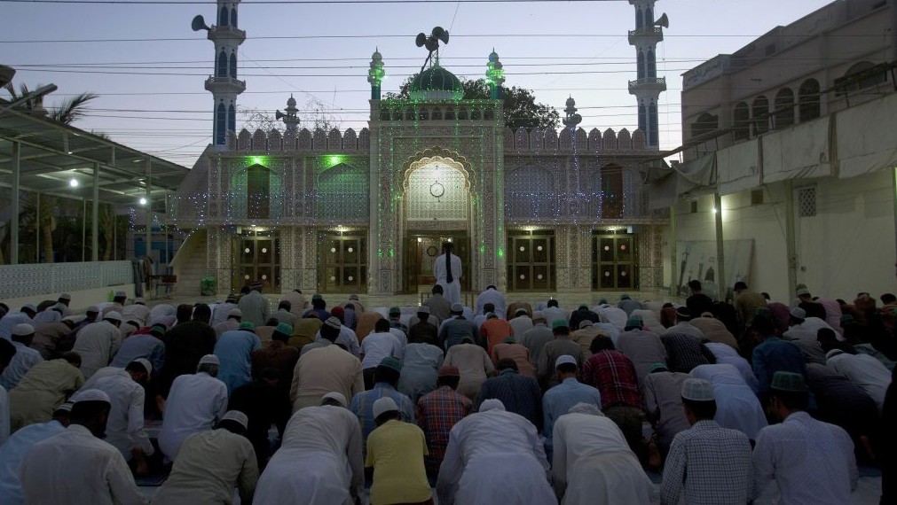 Muslims offering prayer in masjid