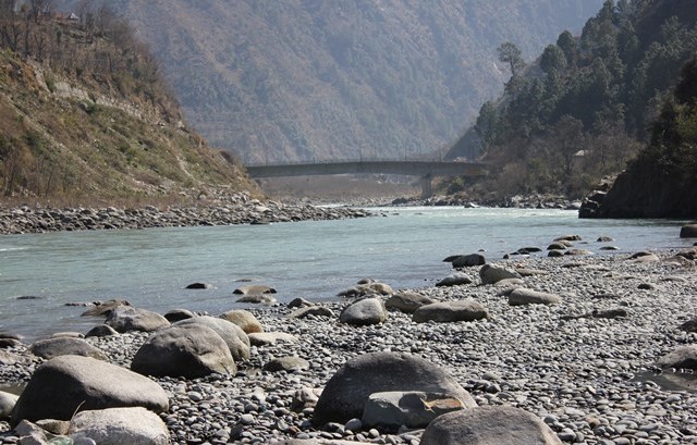 River Ravi surrounded by mountains and pebbles