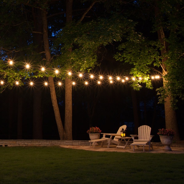 String Lights in garden above chairs