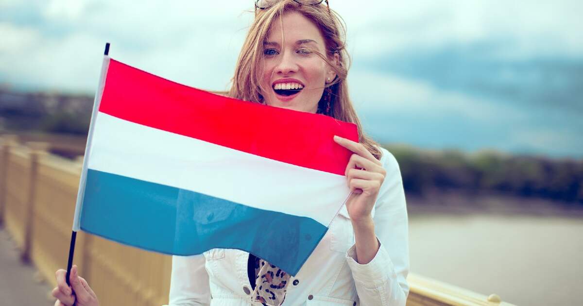 Girl holding Netherlands flag